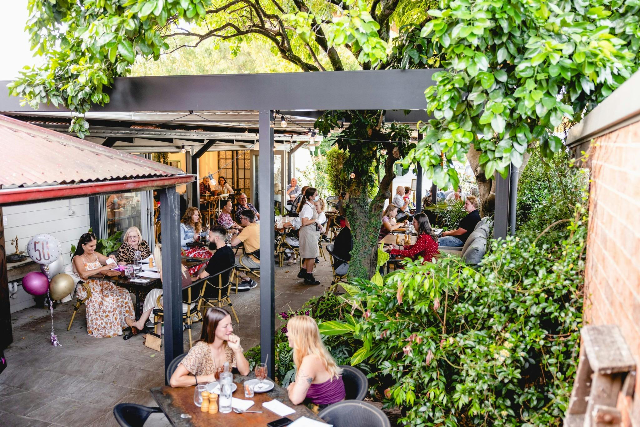 Green and leafy all-weather outdoor dining