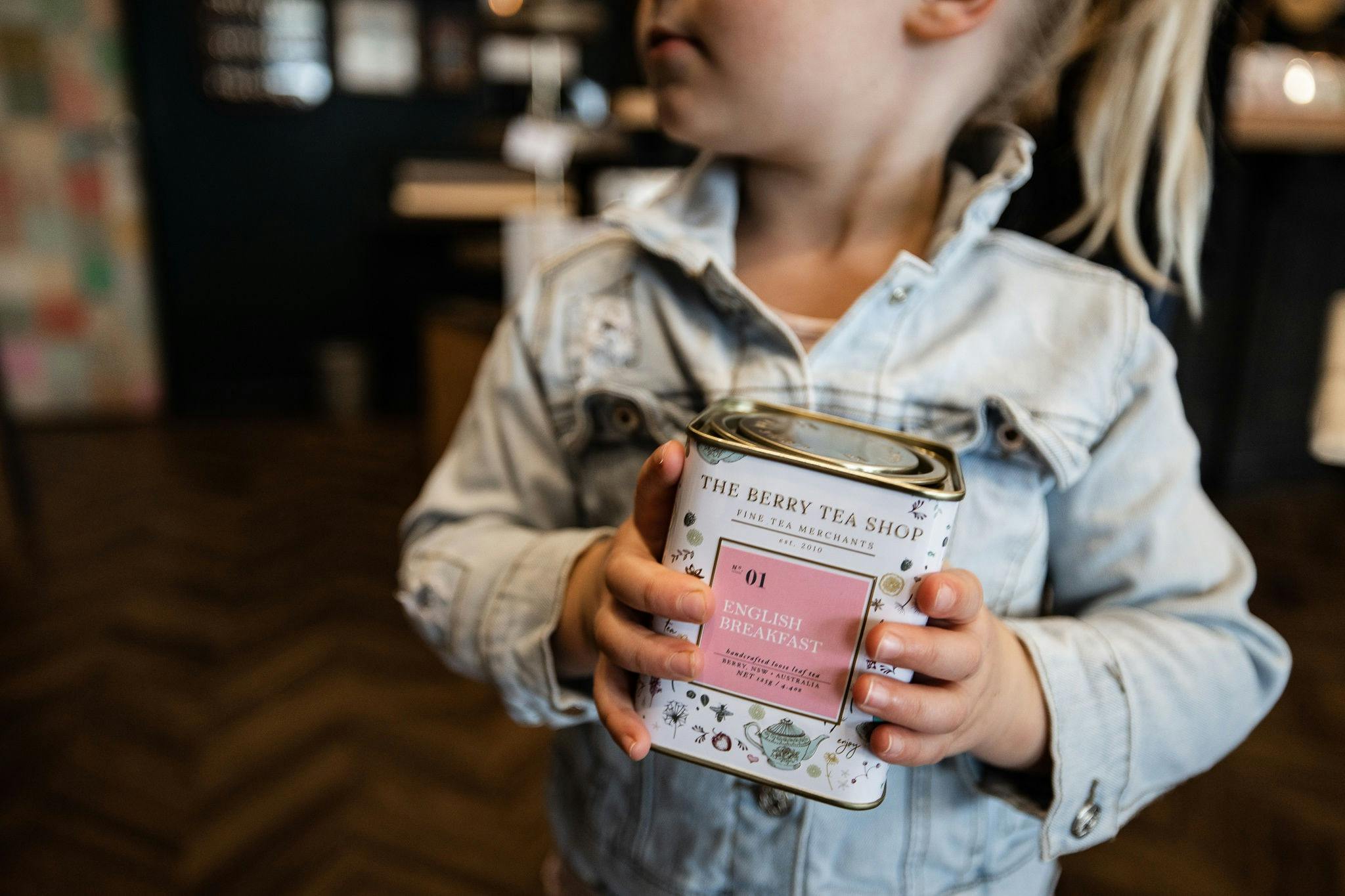 Customer with Tin of Tea