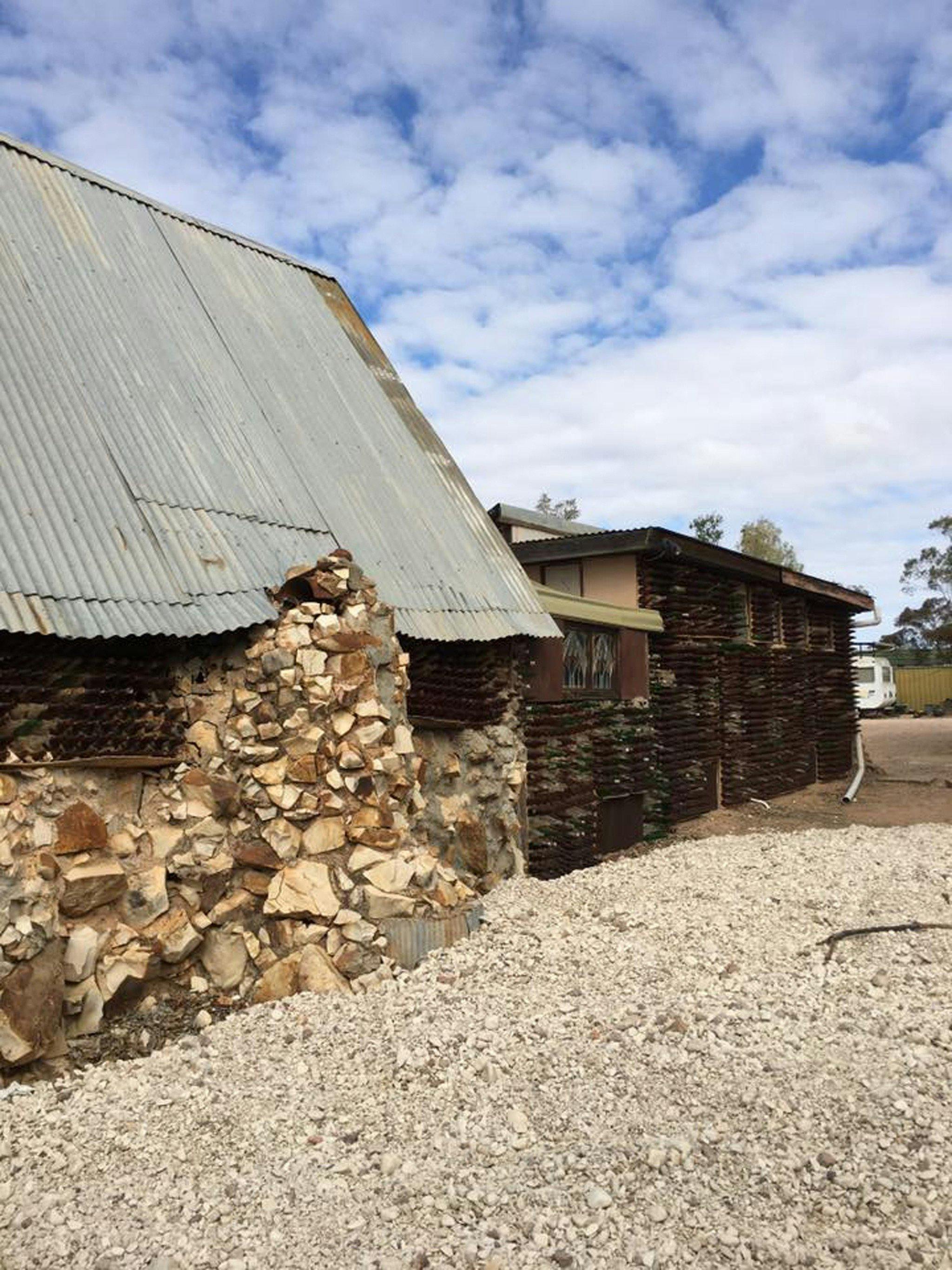 Side view of bottle house