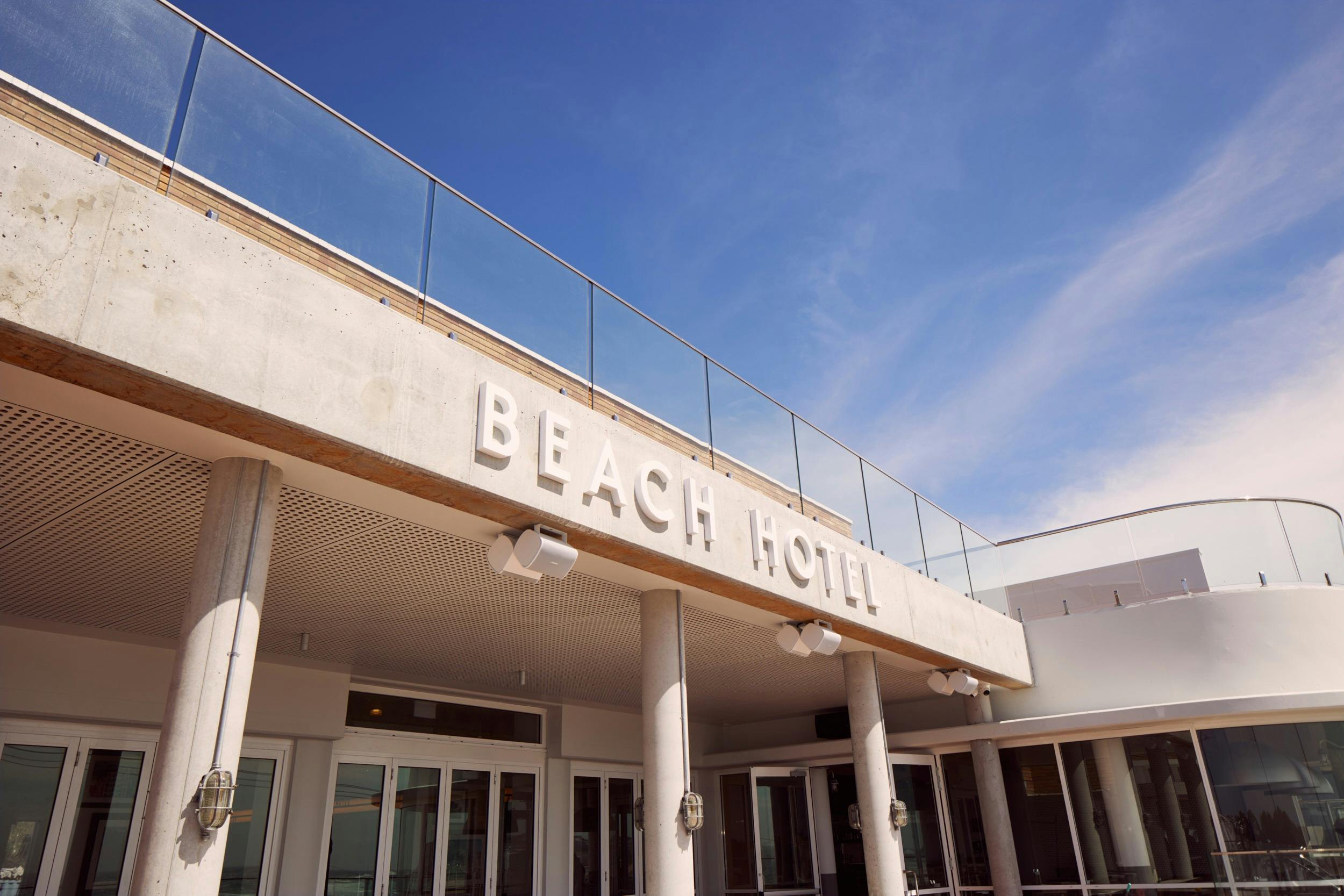 Exterior outside The Beach Hotel on a Sunny day