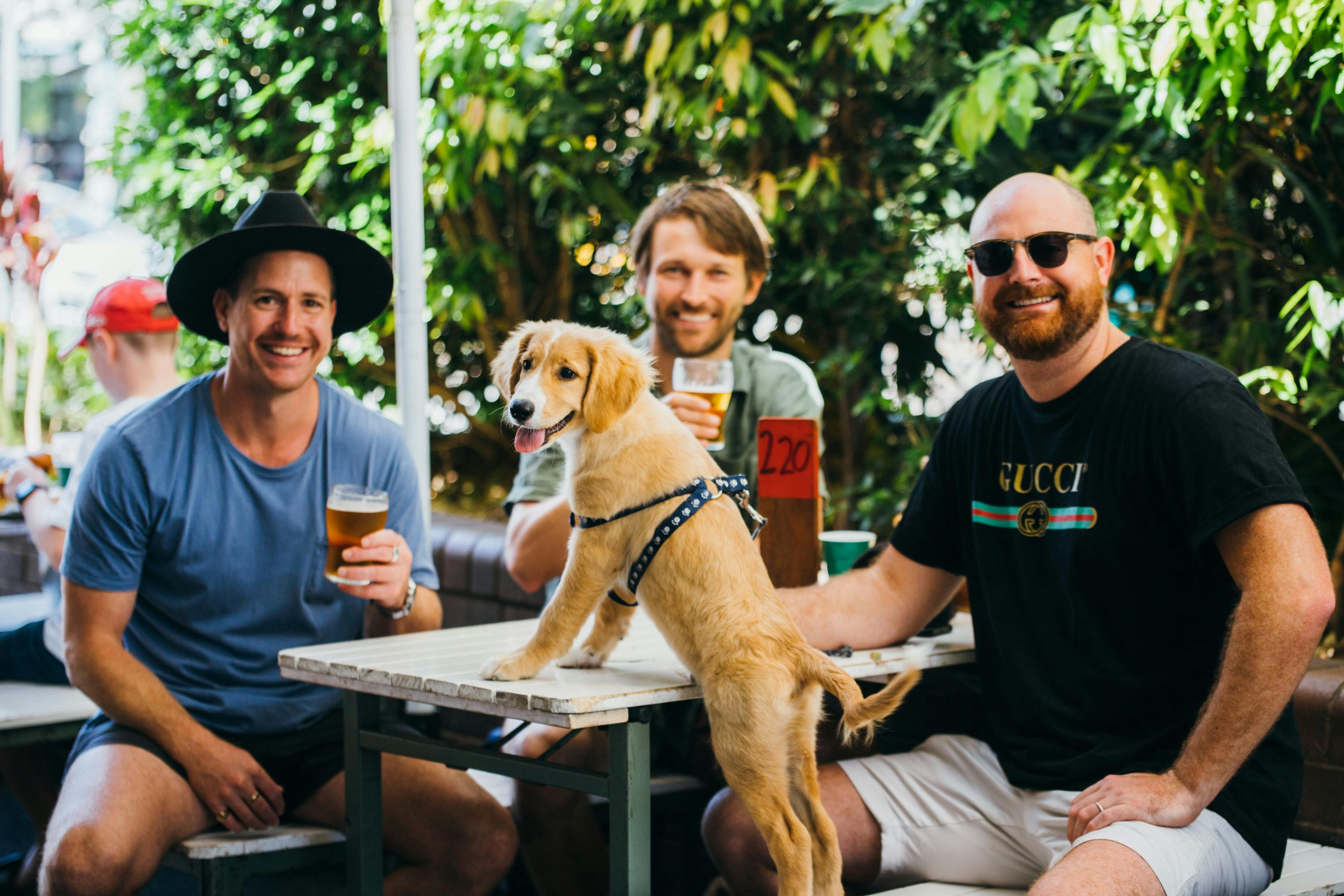 People and dog at table