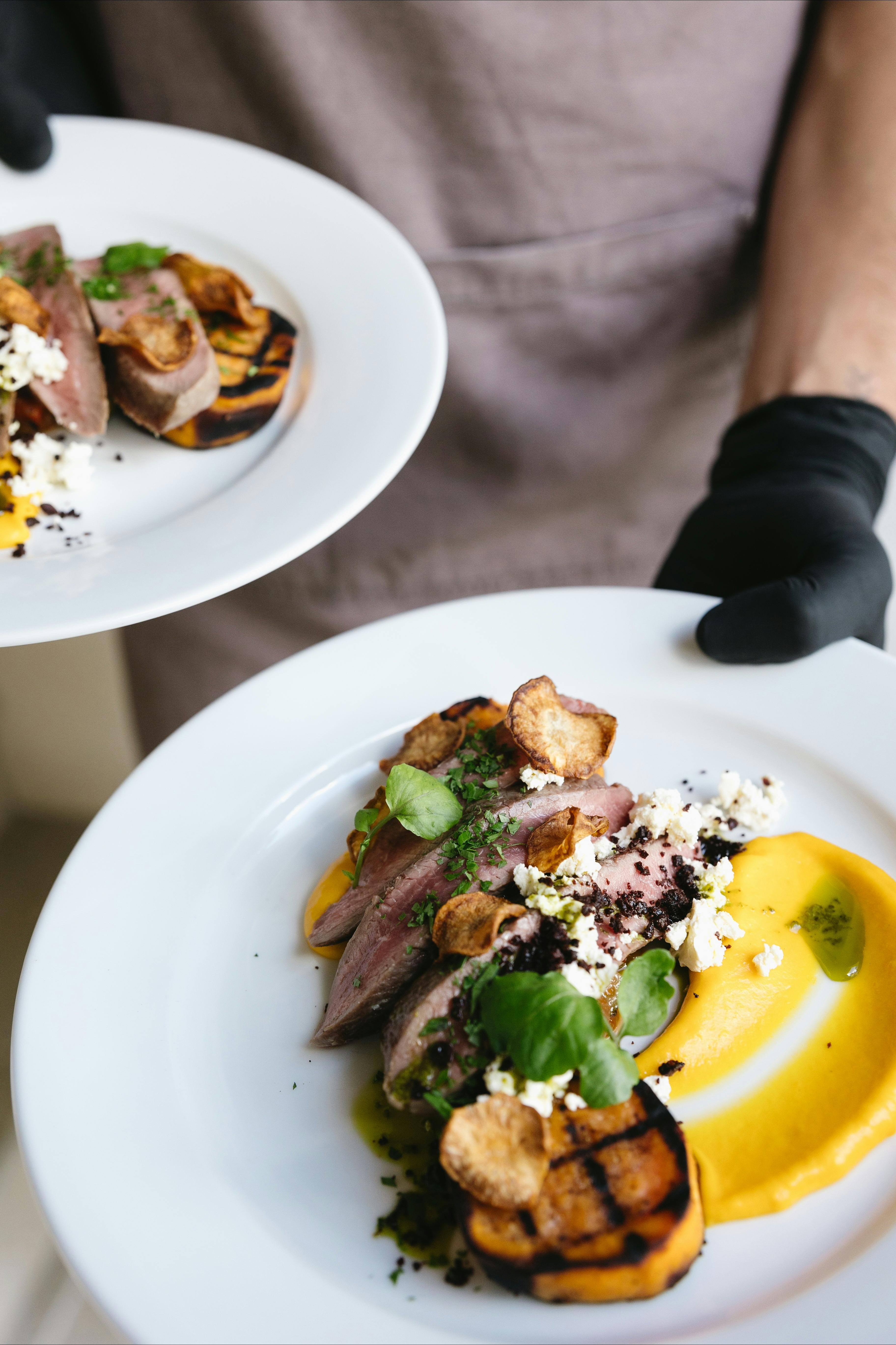 Moorish Spiced Lamb, caponata, charred sweet potato, garlic mushrooms, feta & kale crisps