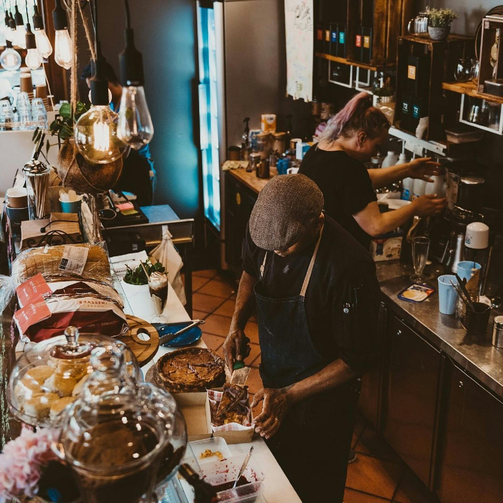 Overhead photo of people preparing food in cafe