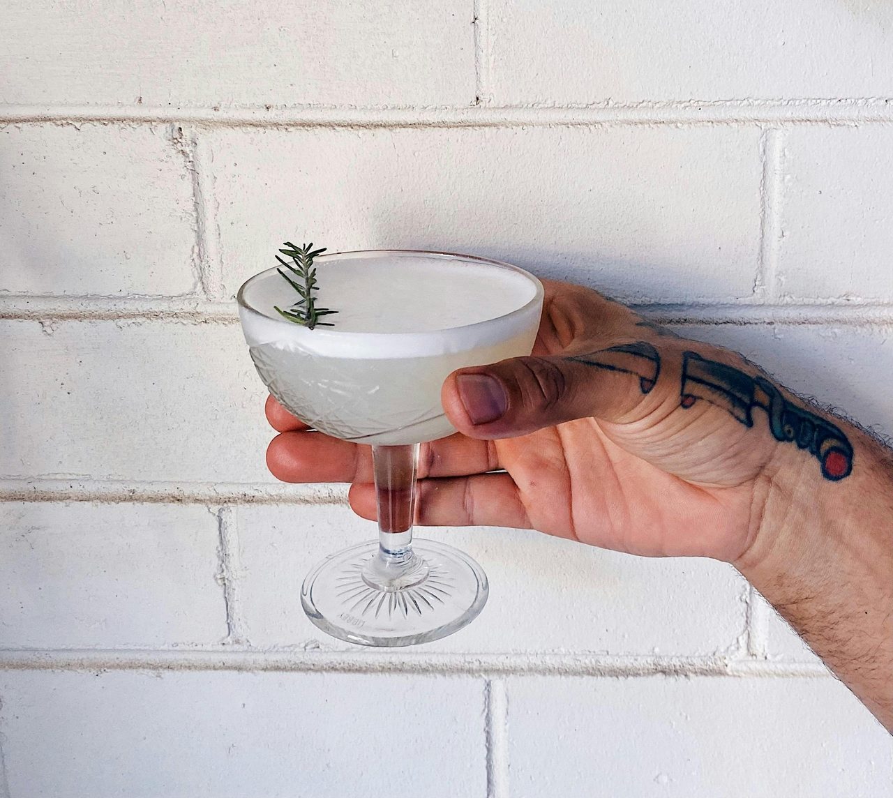 Cocktail against white wall