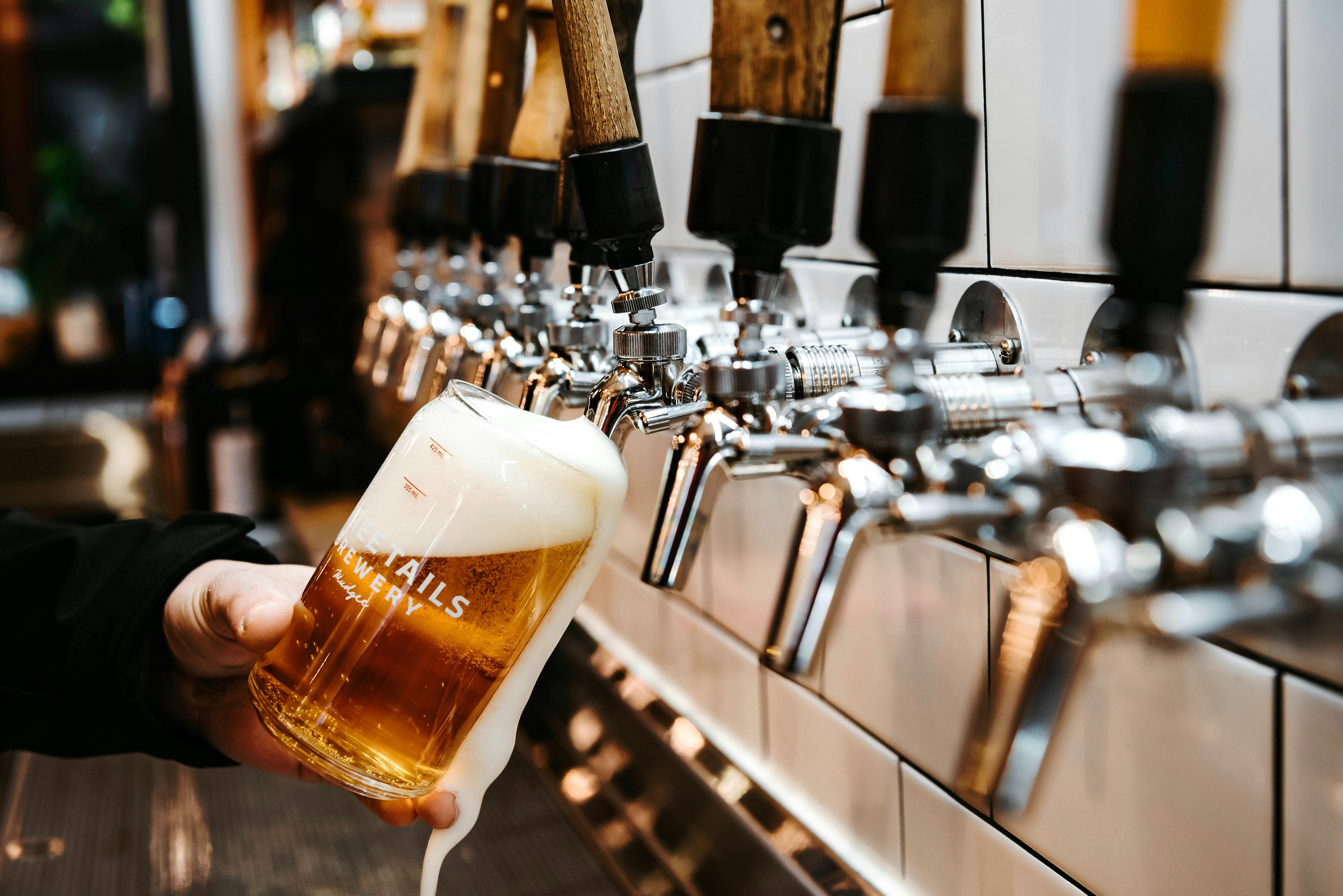 A glass of beer being poured
