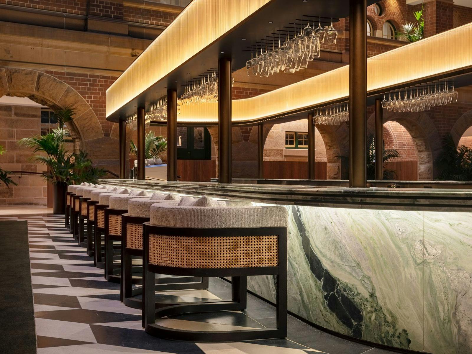 Close up of bar chairs at empty bar