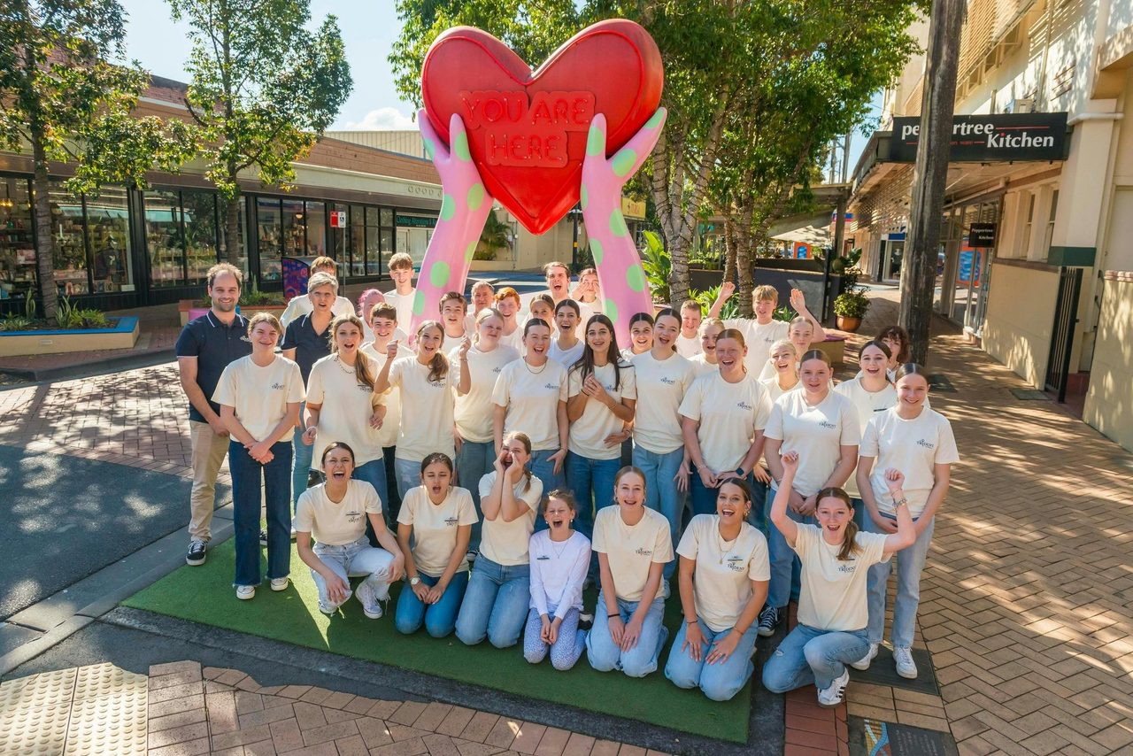 Triden'ts Friendly team in front of the 'You are Here' heart in Lismore