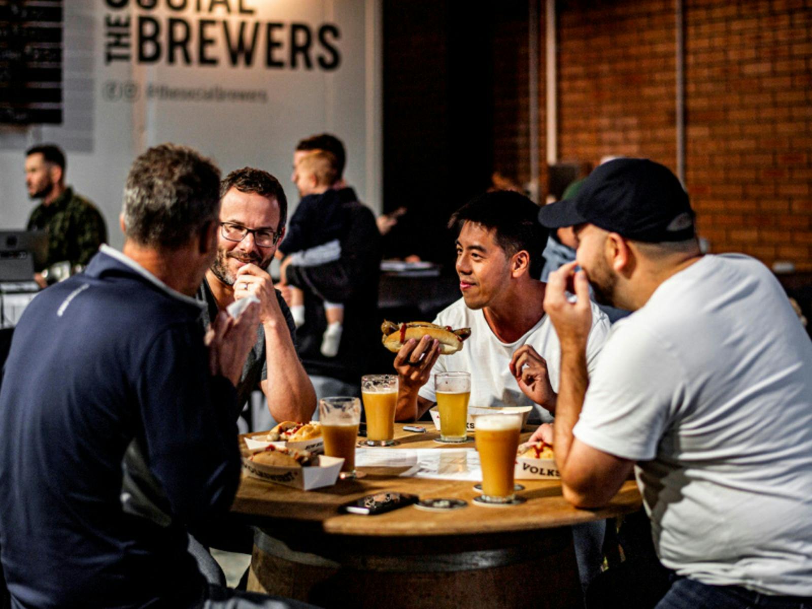 Customers enjoying a meal and a beer at the Social Brewers