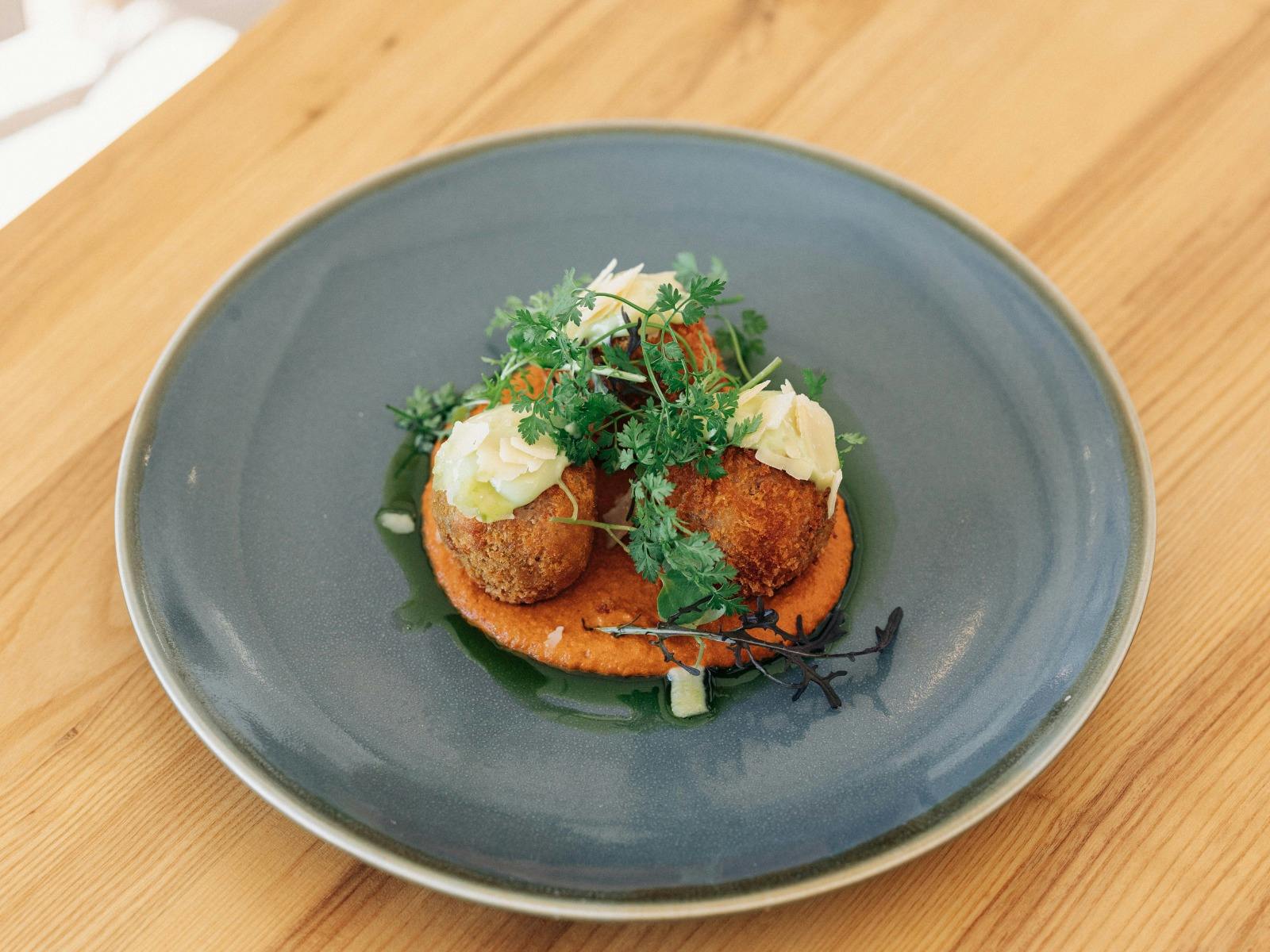 Aranchini Balls on Wooden Table