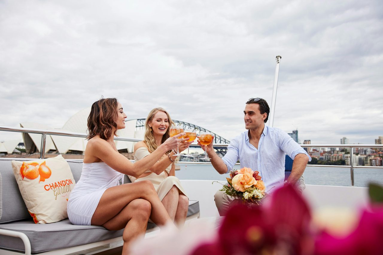 friends enjoying a Chandon Cocktail on outer deck of The Jackson