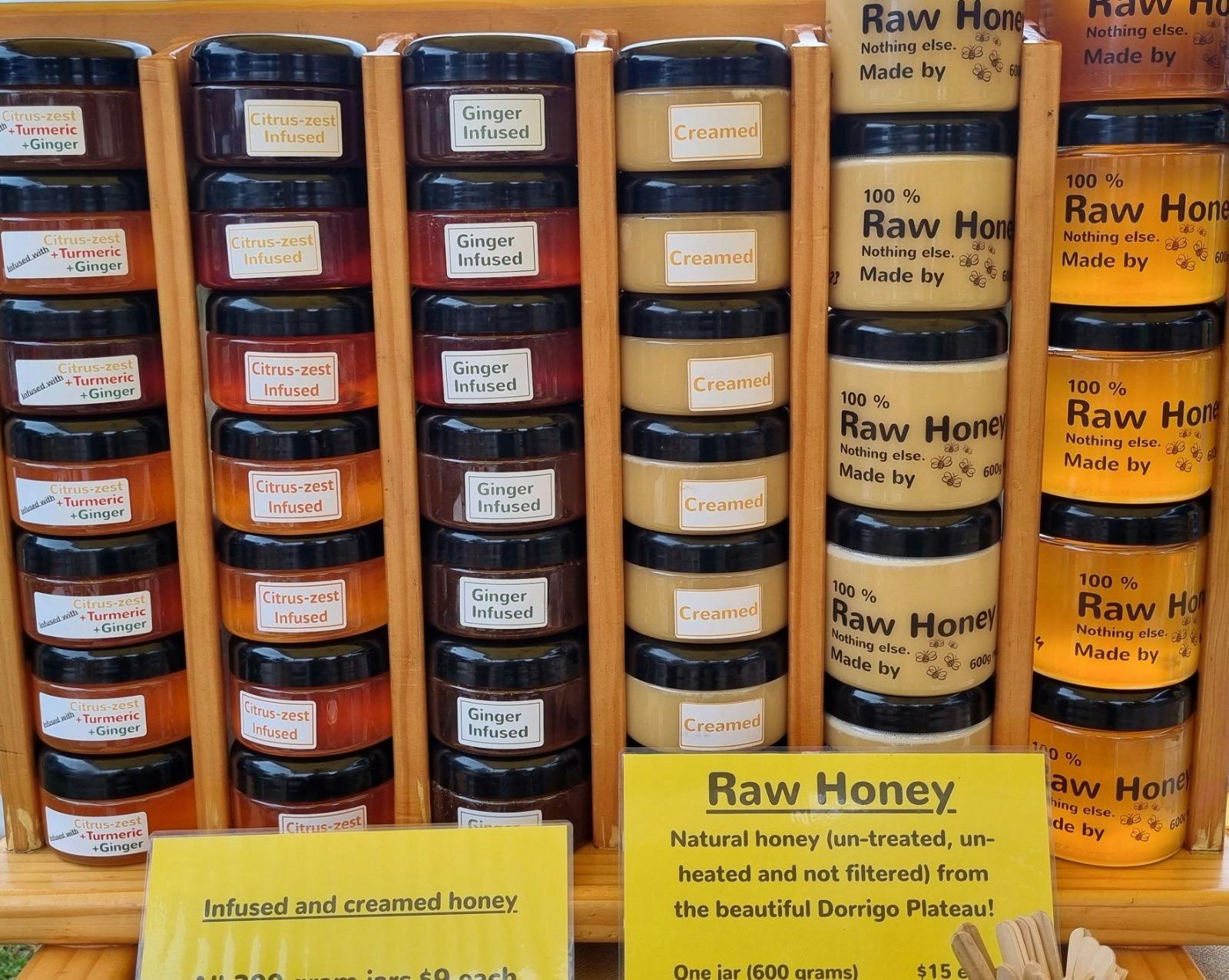 Stack of honey jars in shelf