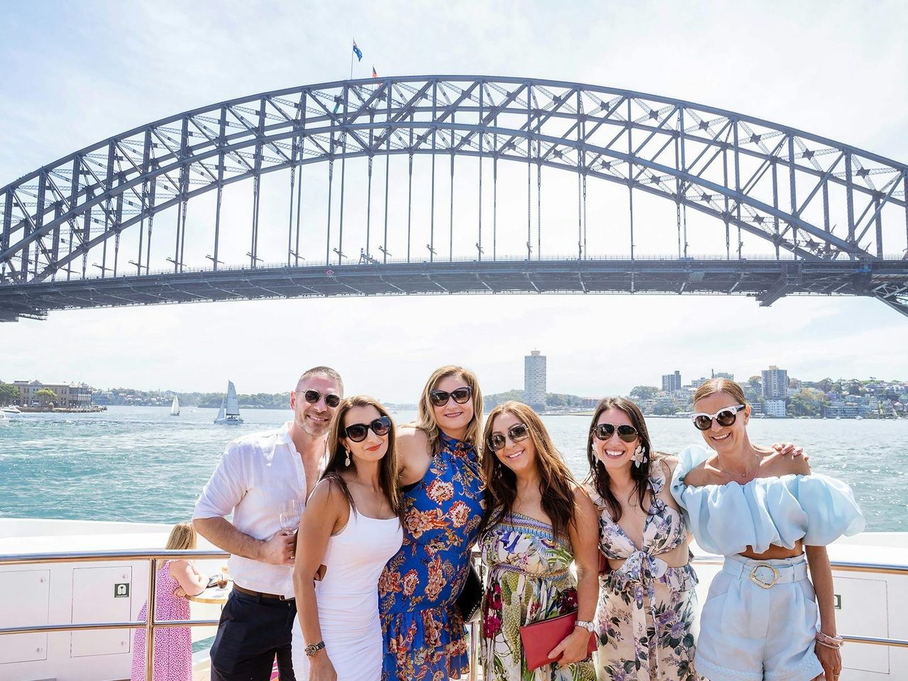 Girl group on Sydney Harbour with Sydney Harbour Bridge