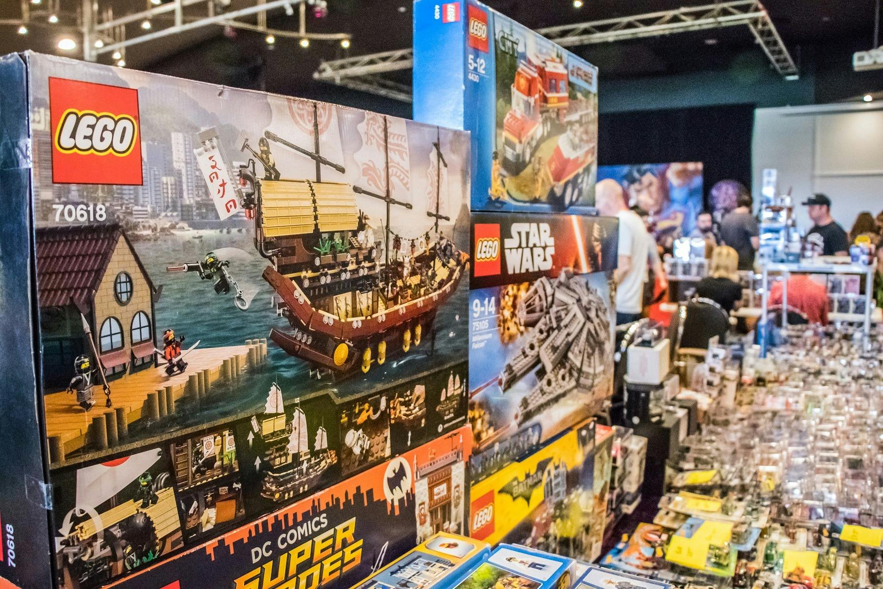 Boxes of Lego builds stacked up on display