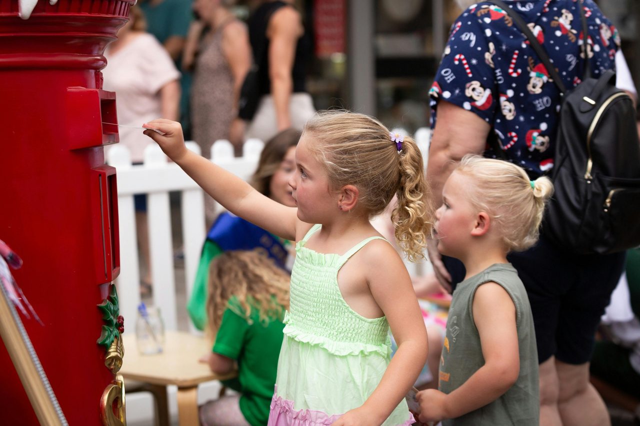 Girl sending santa a card