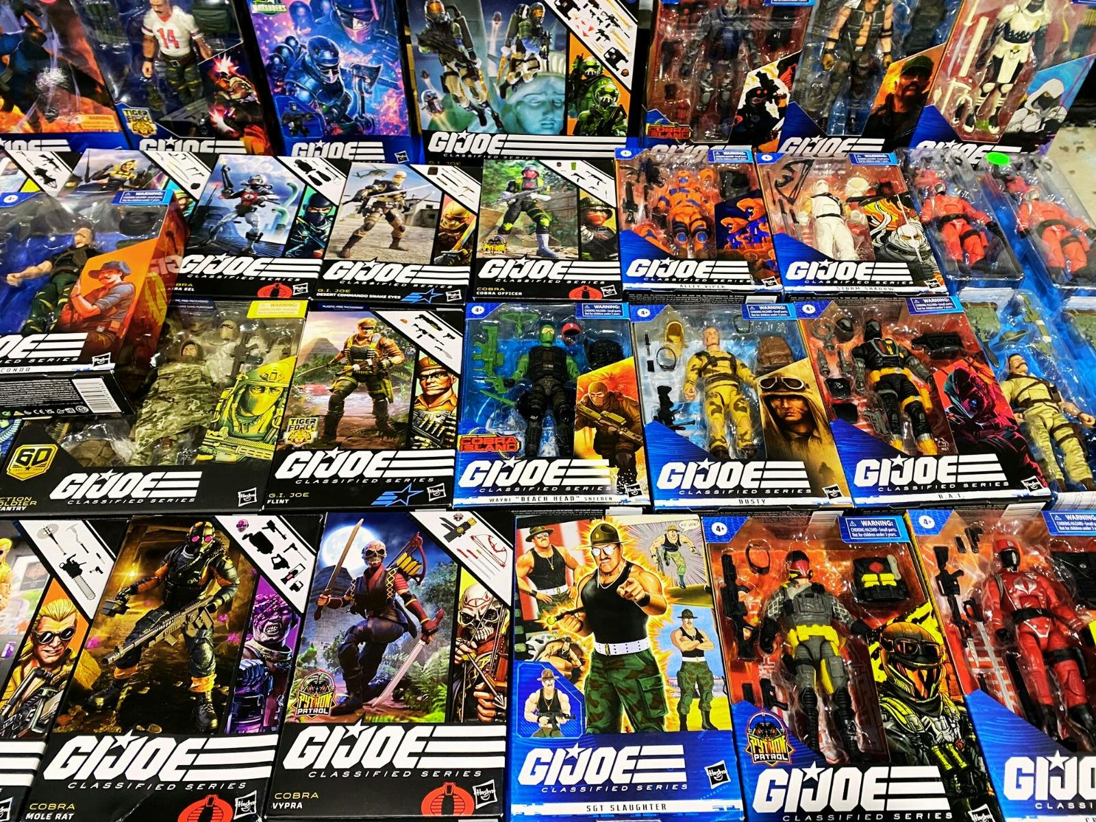 Modern GIJoe boxed action figures on table