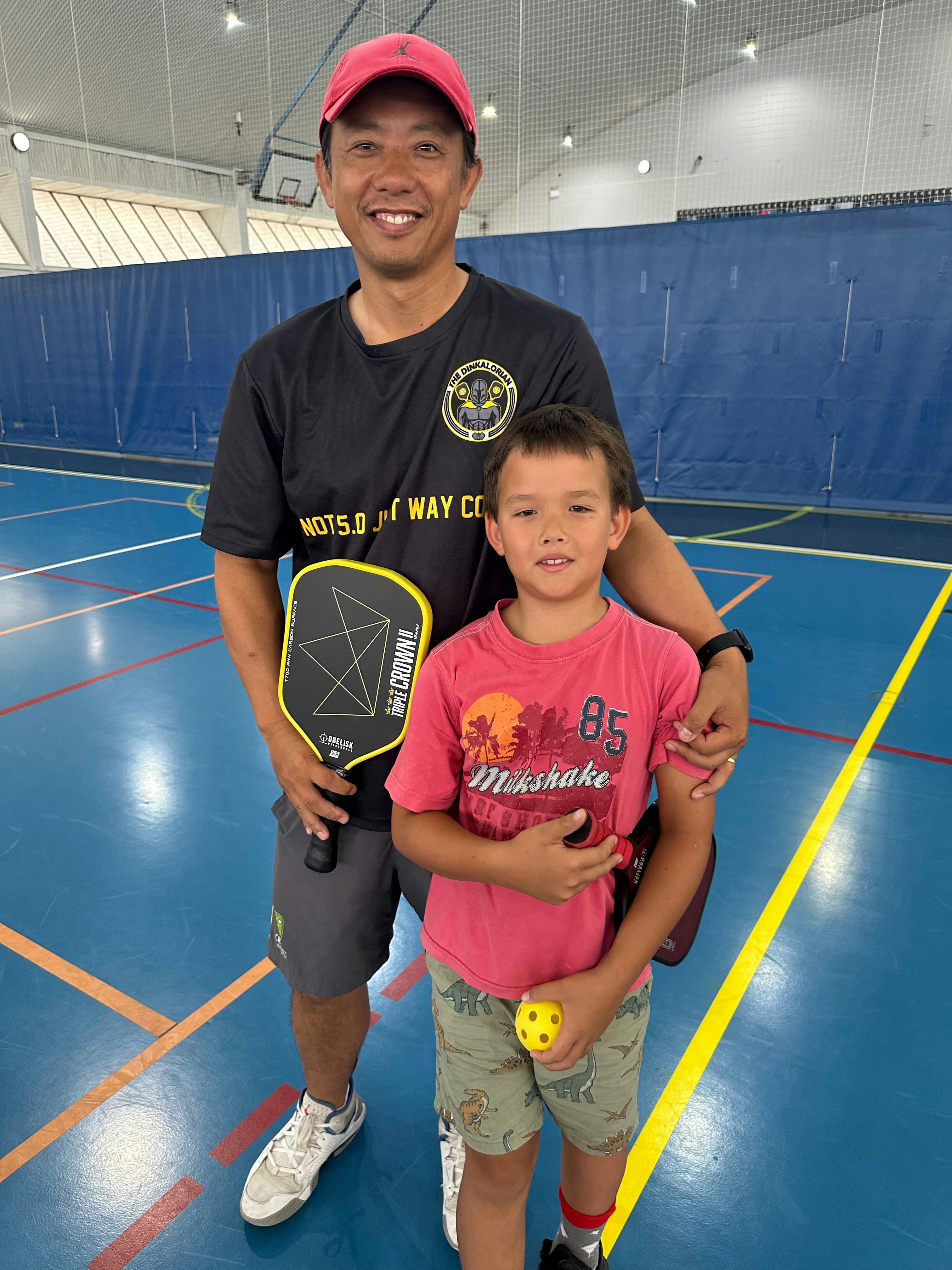 Chen and son playing Pickleball