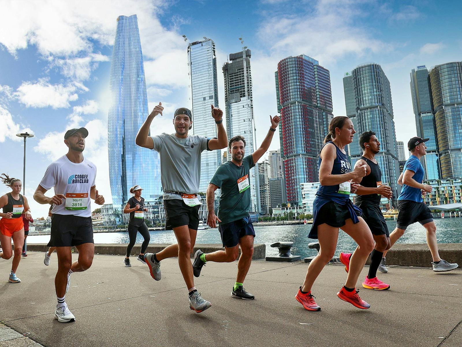 Runners running across around Sydney CBD