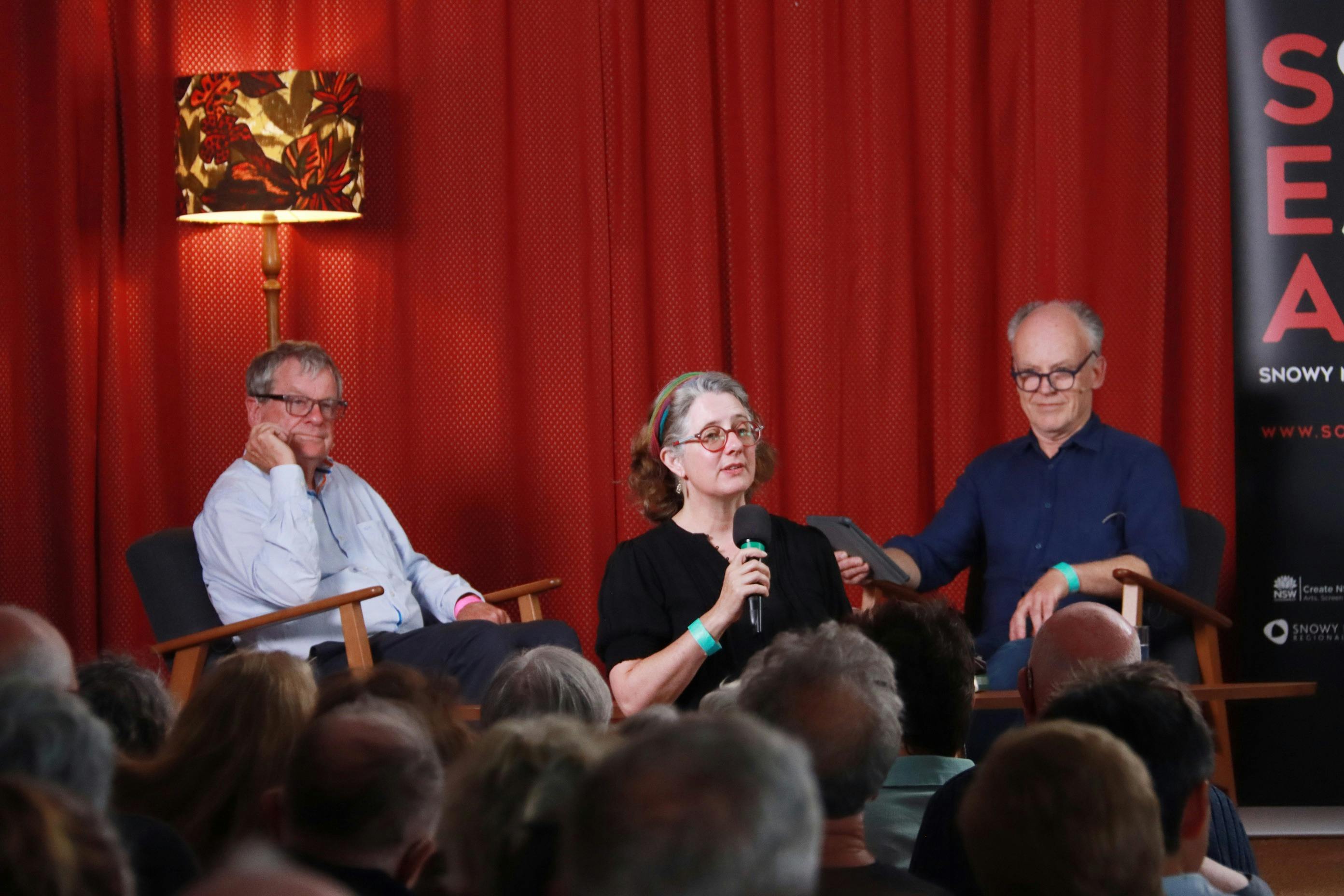 Chris Masters and Mark McKenna on stage with Becky Lupton MC