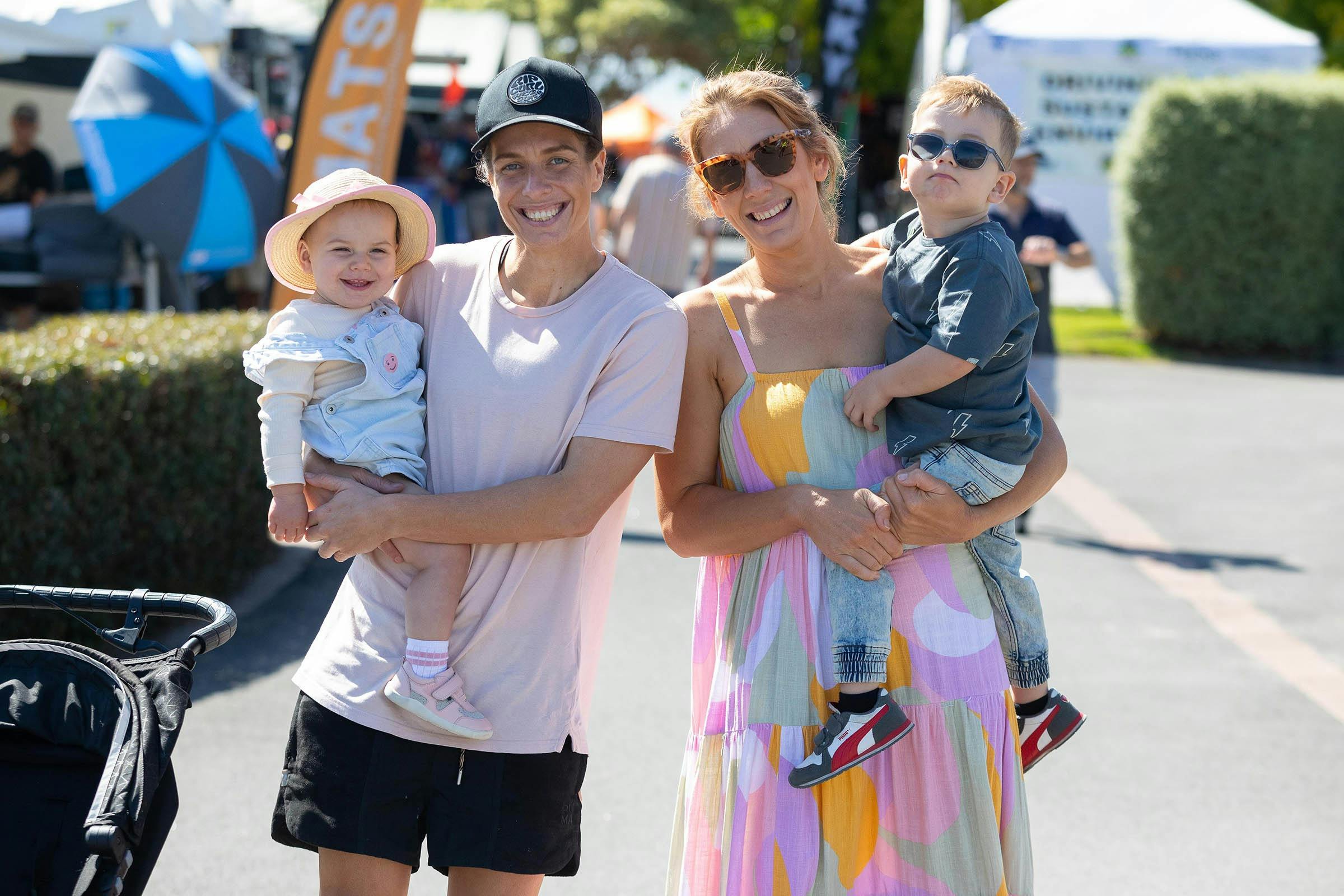 A family of four with big smiles enjoying the Outdoor Living & Caravan Expo