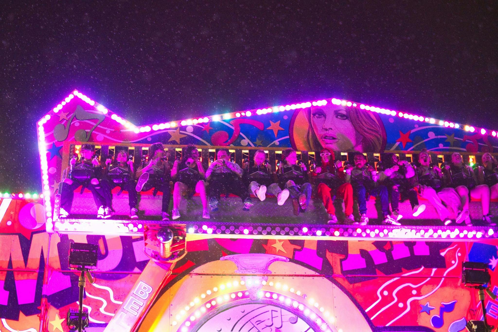 An amusement ride with colorful stage moving in a circular motion