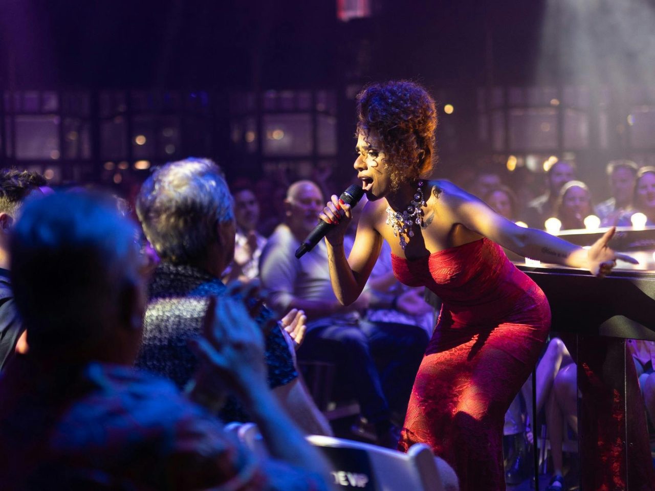 performer singing at La Ronde