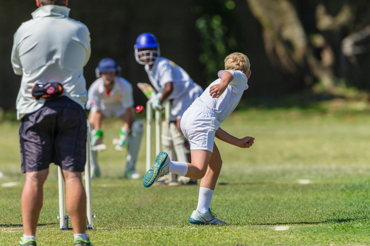 Boys playing cricket