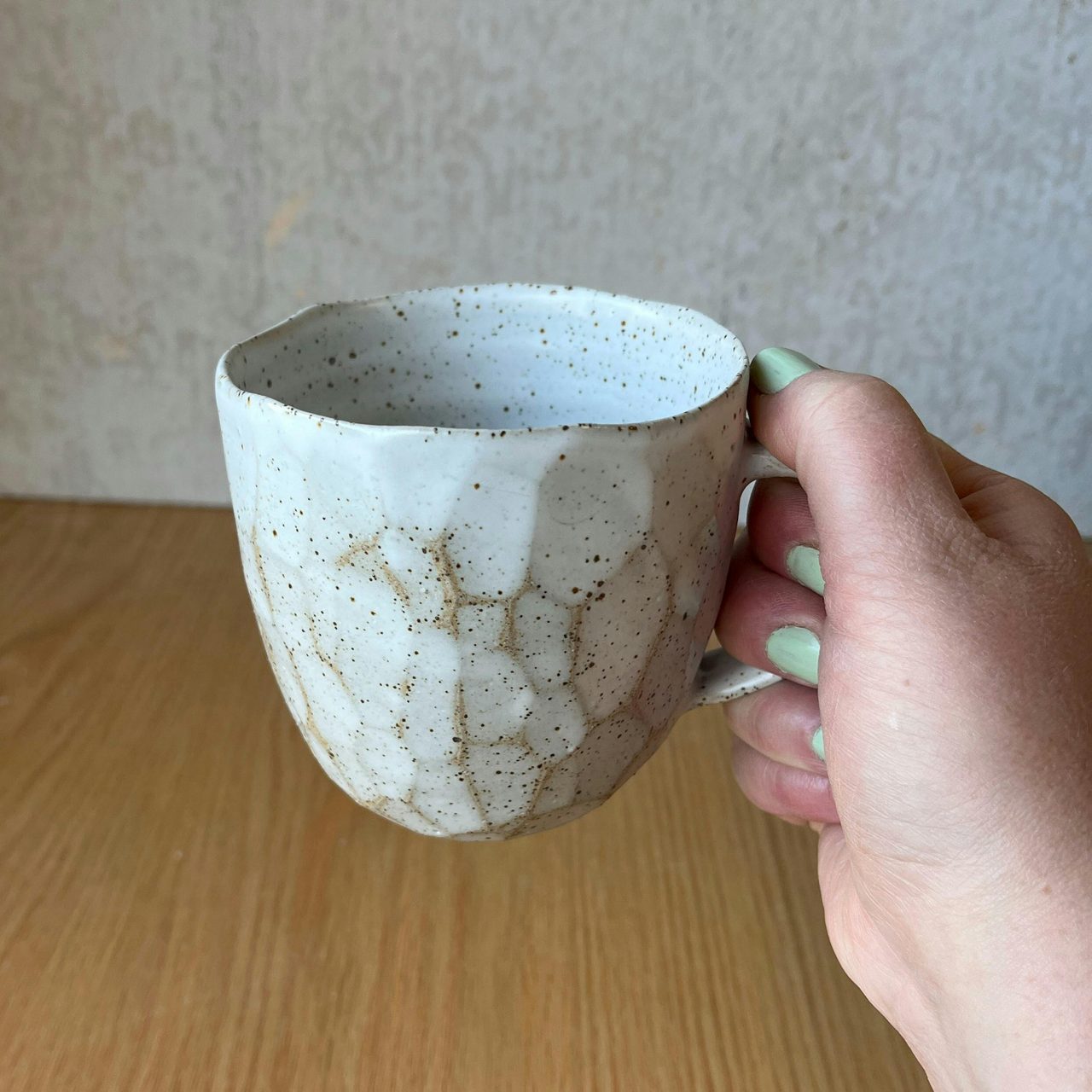 Large faceted speckled mug