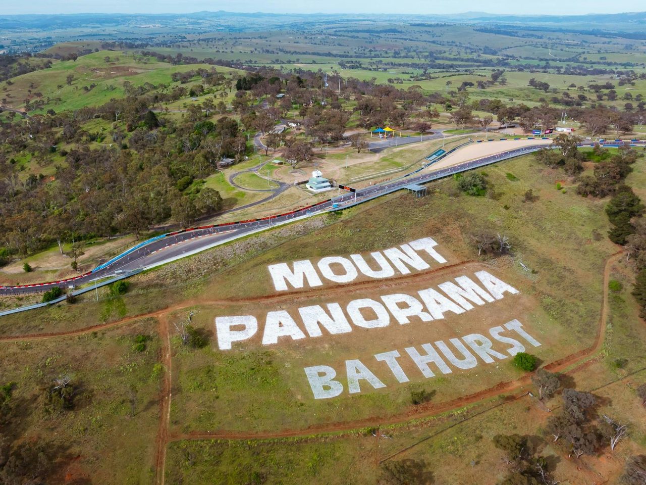 Aerial shot of Mount Panorama during the Mount Panorama Punish showing runners at the top.