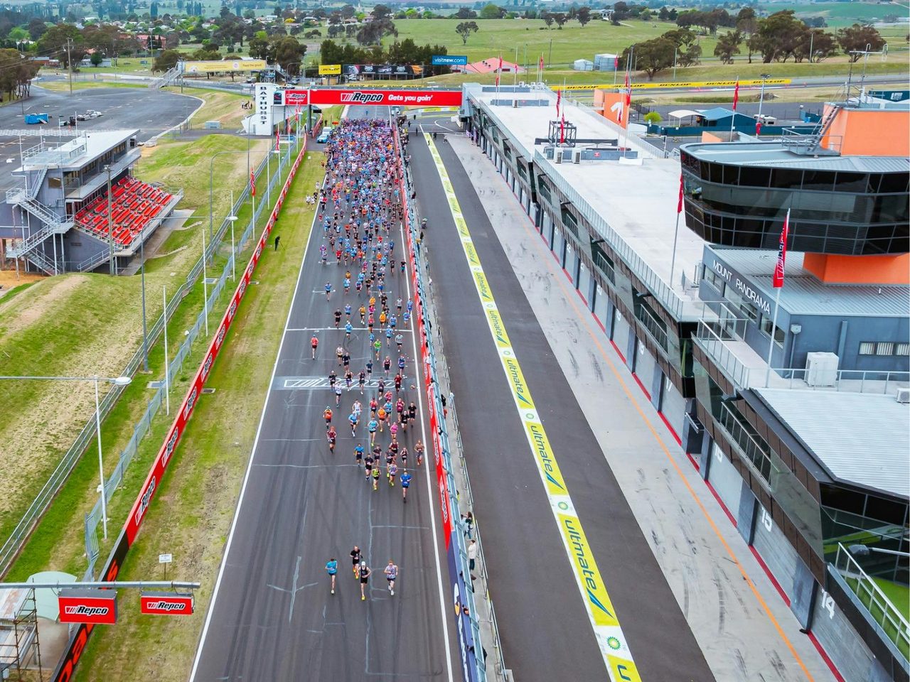 Aerial shot of the start of the Mount Panorama Punish showing runners on Pitt Straight.