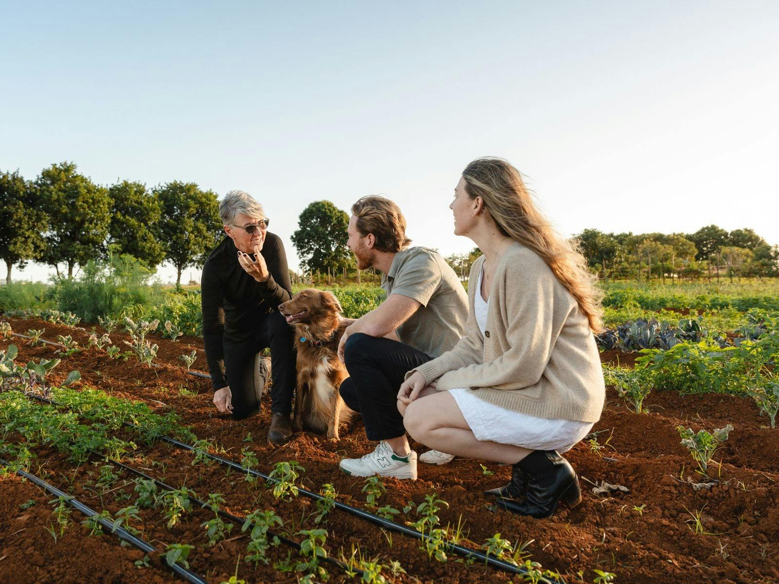 Couple on farm tour with farmer
