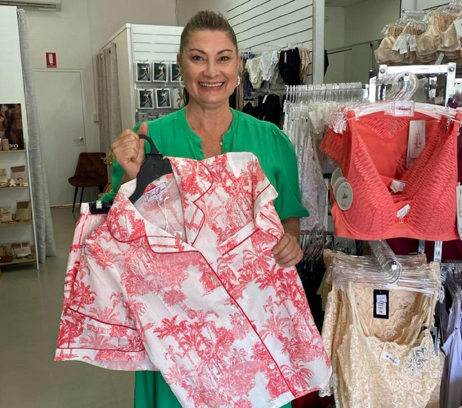 Cherie showcasing stock in her shop