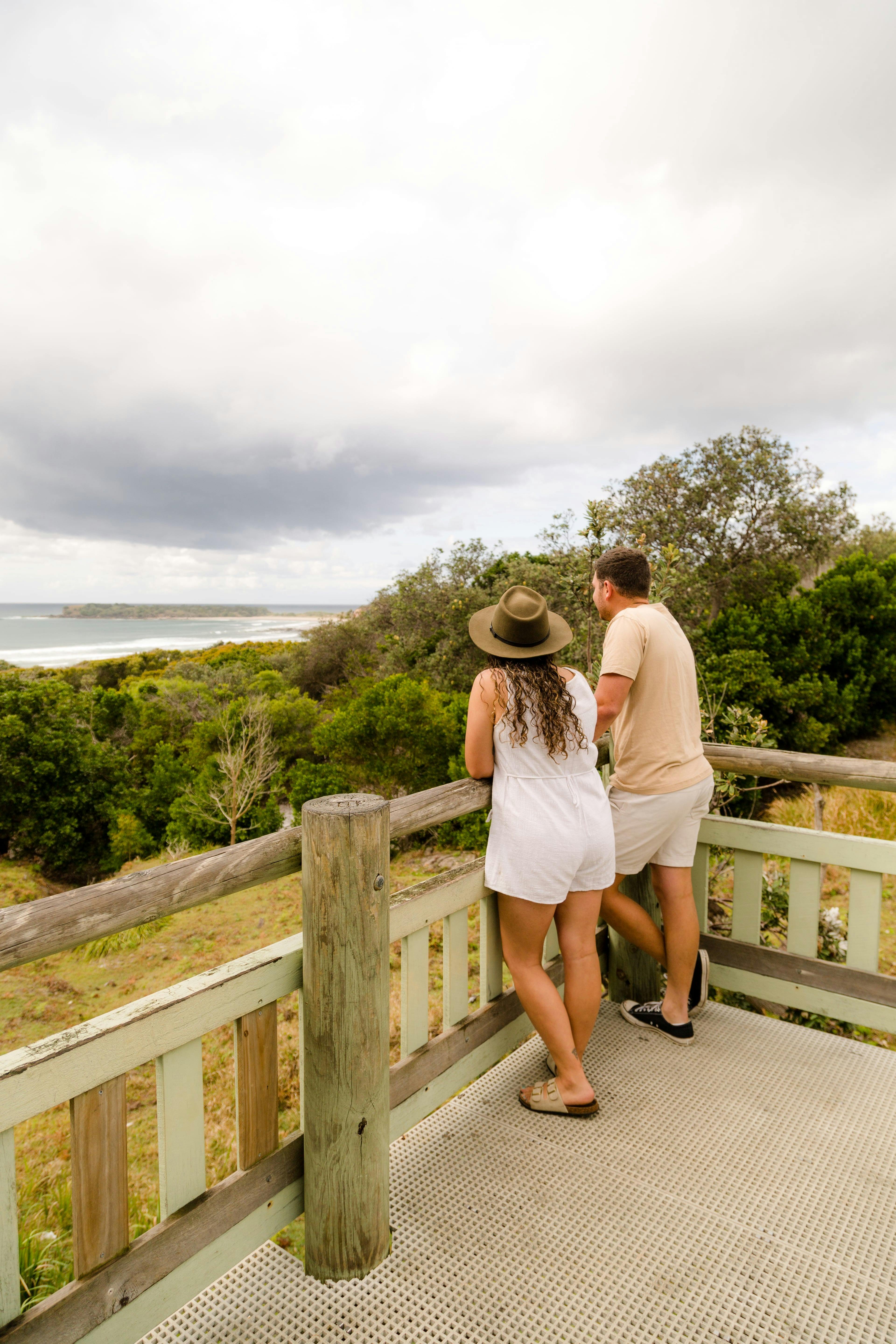 A lady and a man enjoying views at a lookout