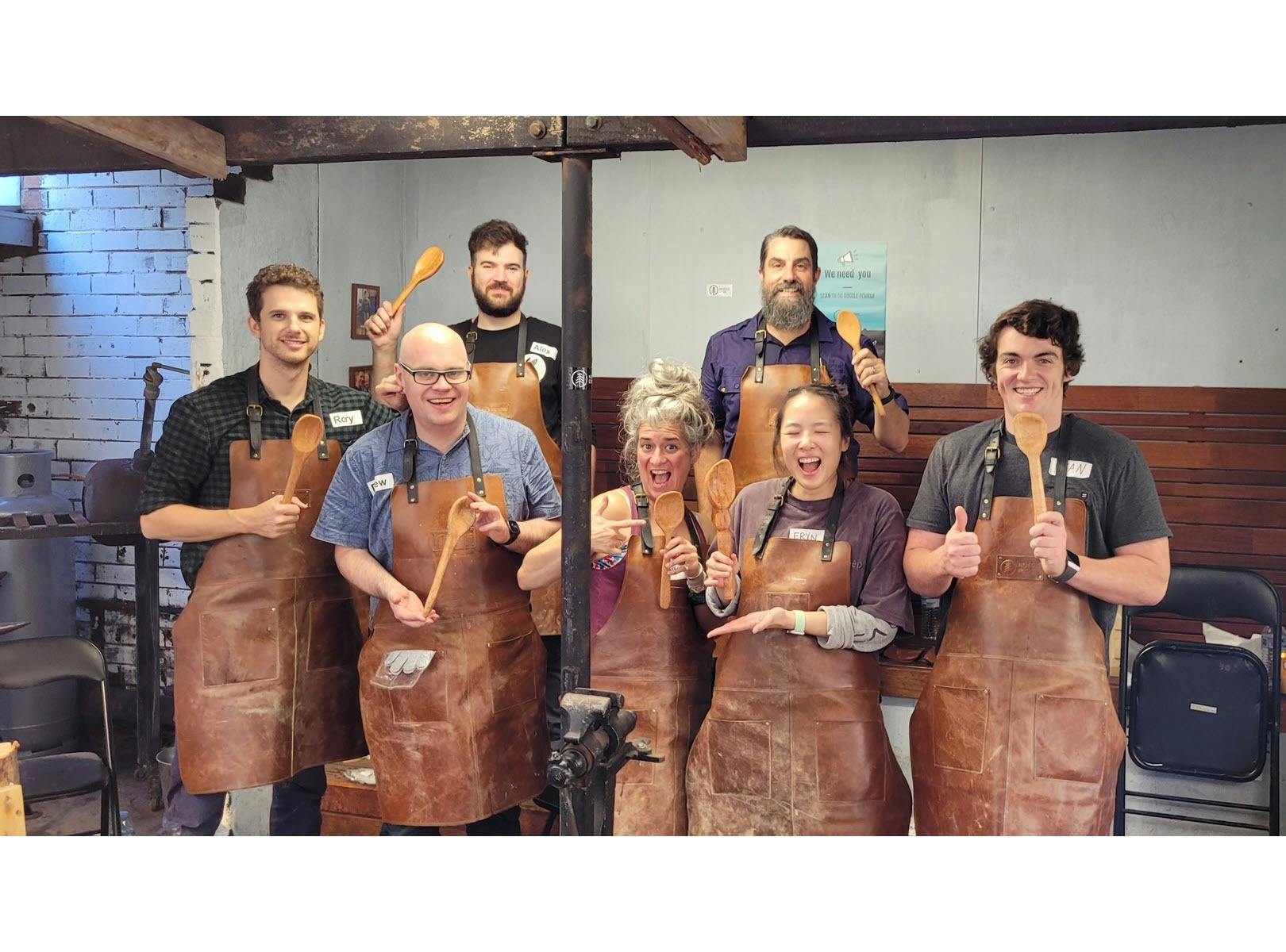 happy students with their carved spoons