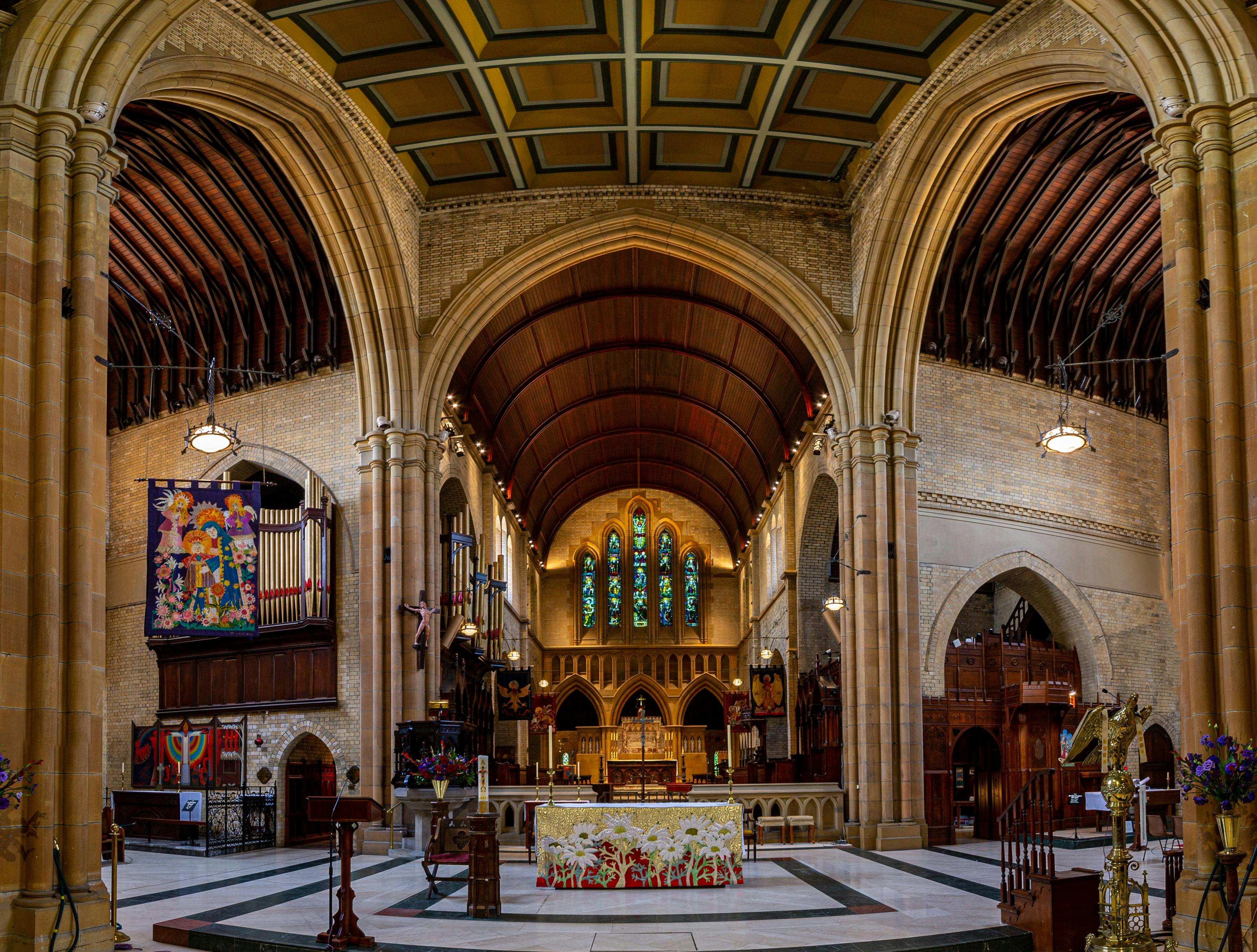 The magnificent stain glass windows above the high altar and stunning pipe organ.