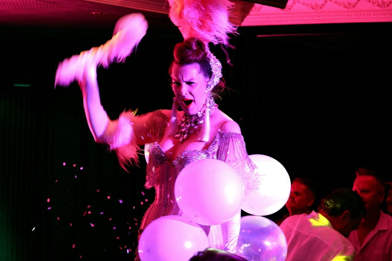 Burlesque dancer Lara Love performs in Talk and Tease with her classic balloon pop routine.
