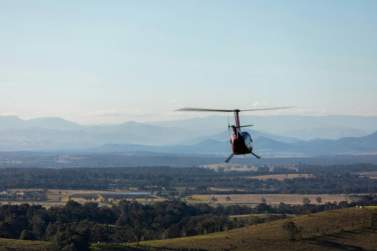 Aerologistics helicopter in front of Barrington Tops