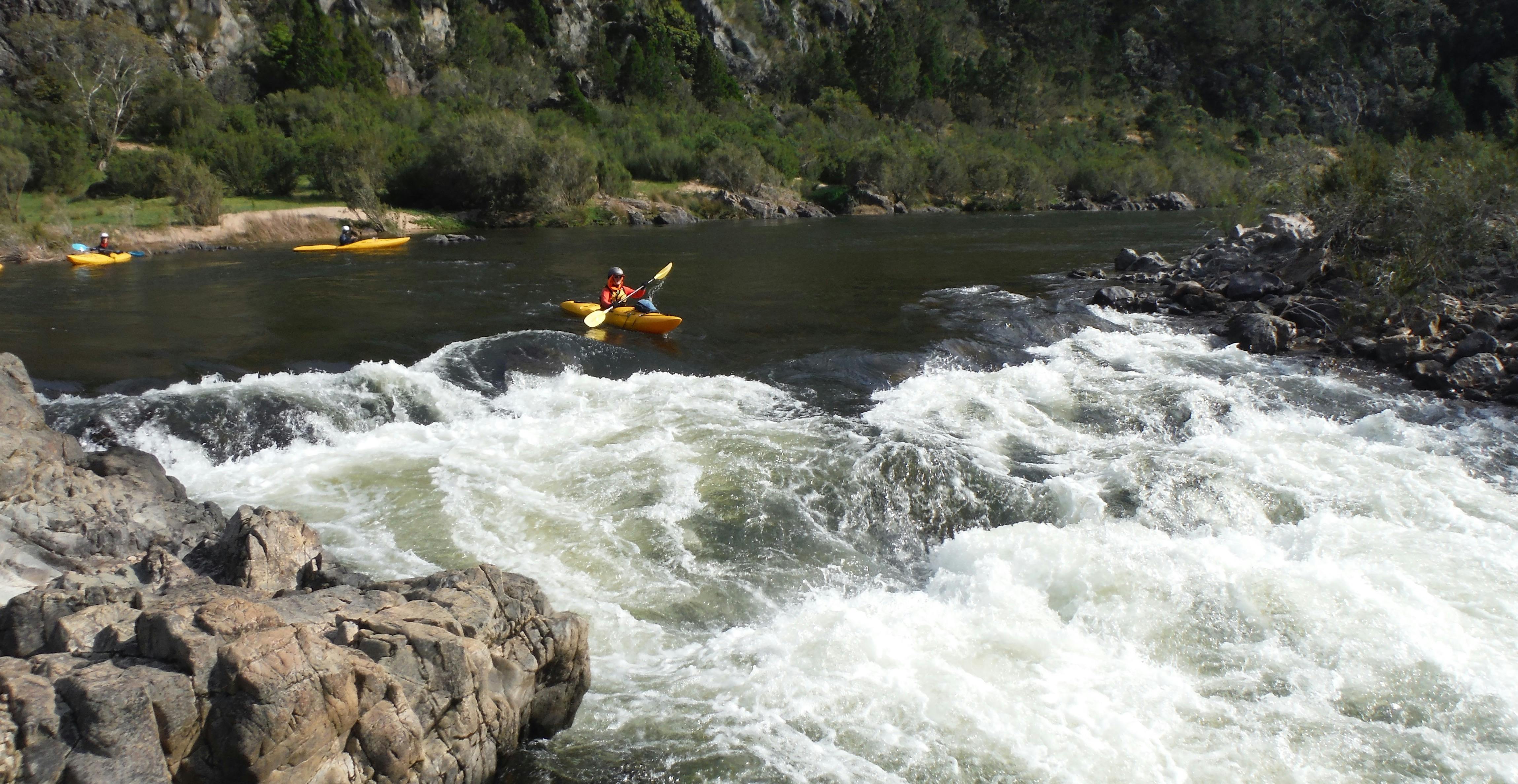 A nervous kayaker lines up on a rapid