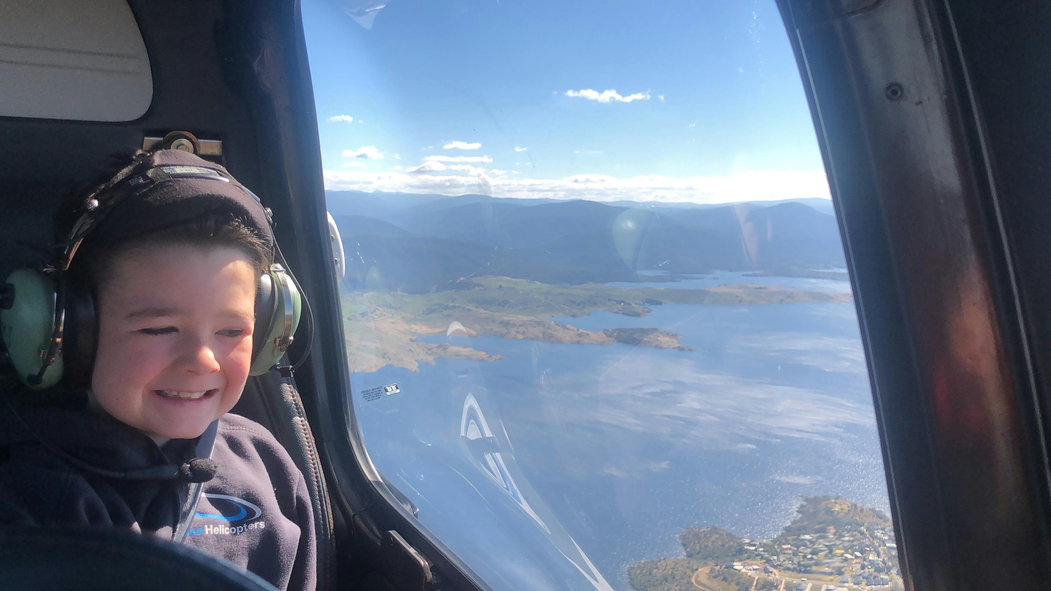 Children love the magic of flying in a helicopter. Flying out over Lake Jindabyne. Things to do.
