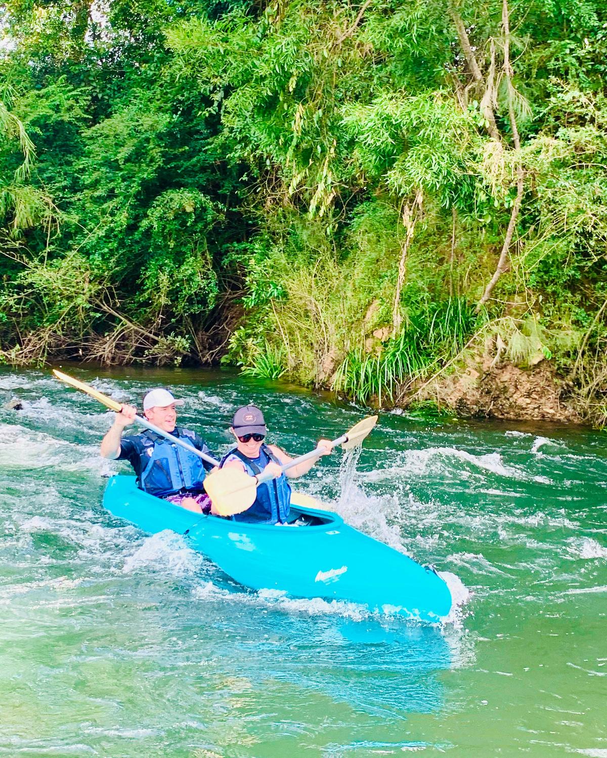 Fun Fun Fun as the couple manoeuvre their double canoe through the rapids with Bellingen Canoes