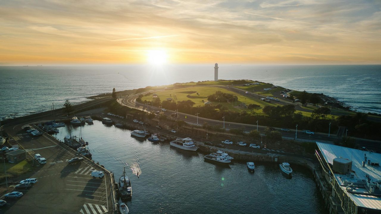 A drone shot of Wollongong Harbour lighthouse and marina