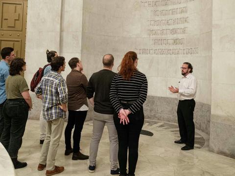 A guide leading a tour in the Anzac Memorial