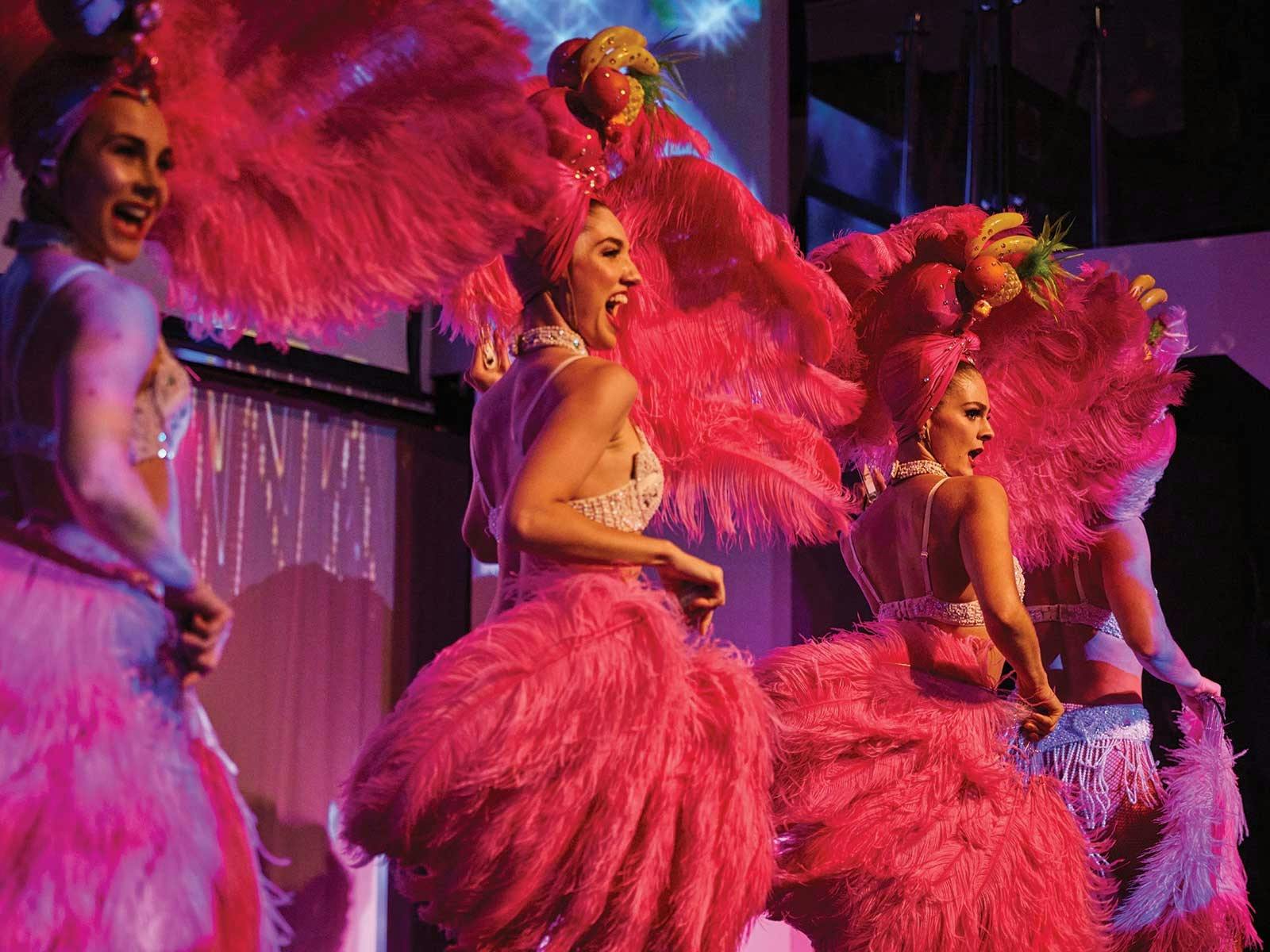 The talented follies performing on stage during the cabaret show aboard Showboat's dinner cruise