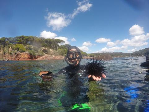 Guest proudly holding their catch
