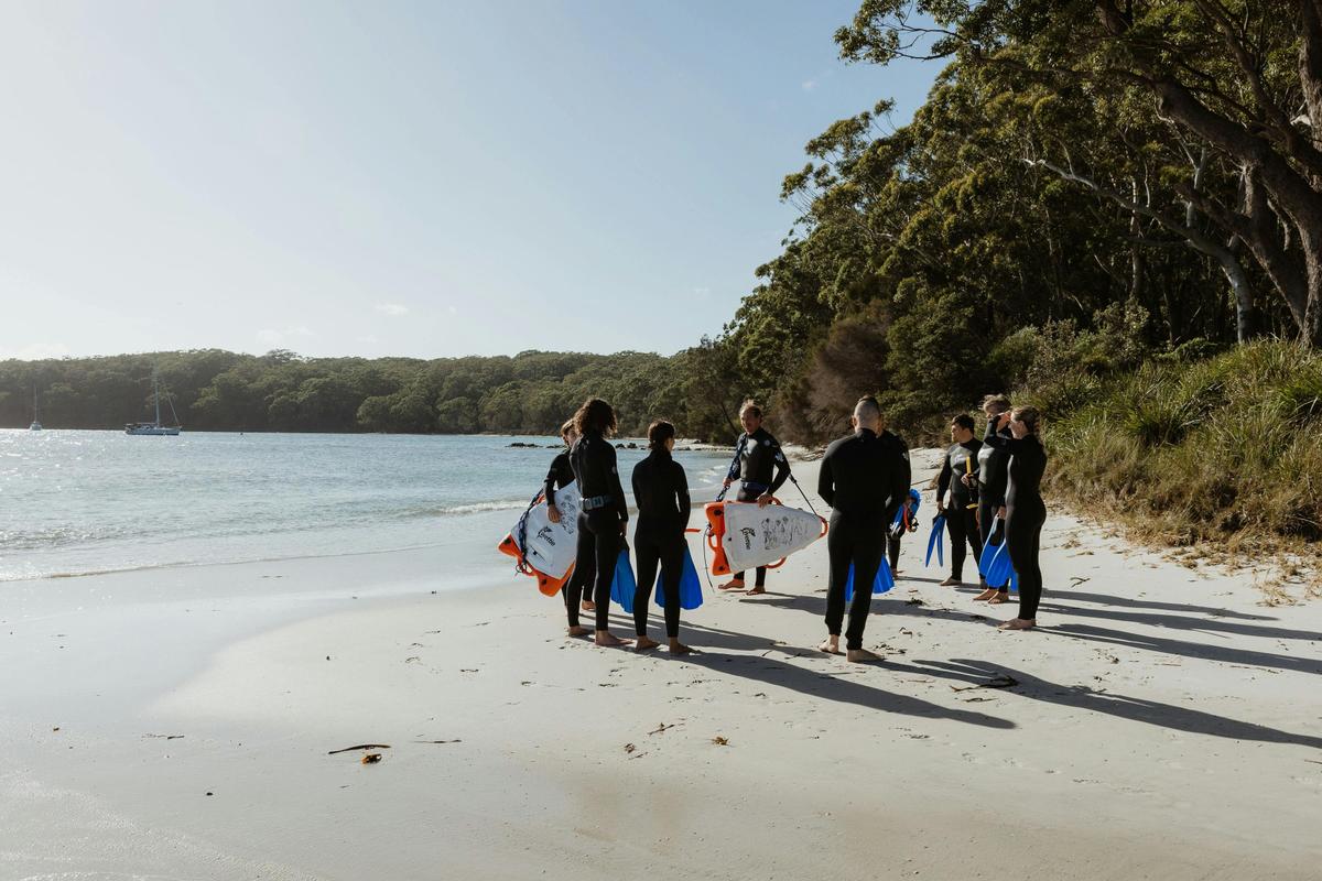 Preparing to enter the clear waters of Jervis Bay during a guided snorkelling tour