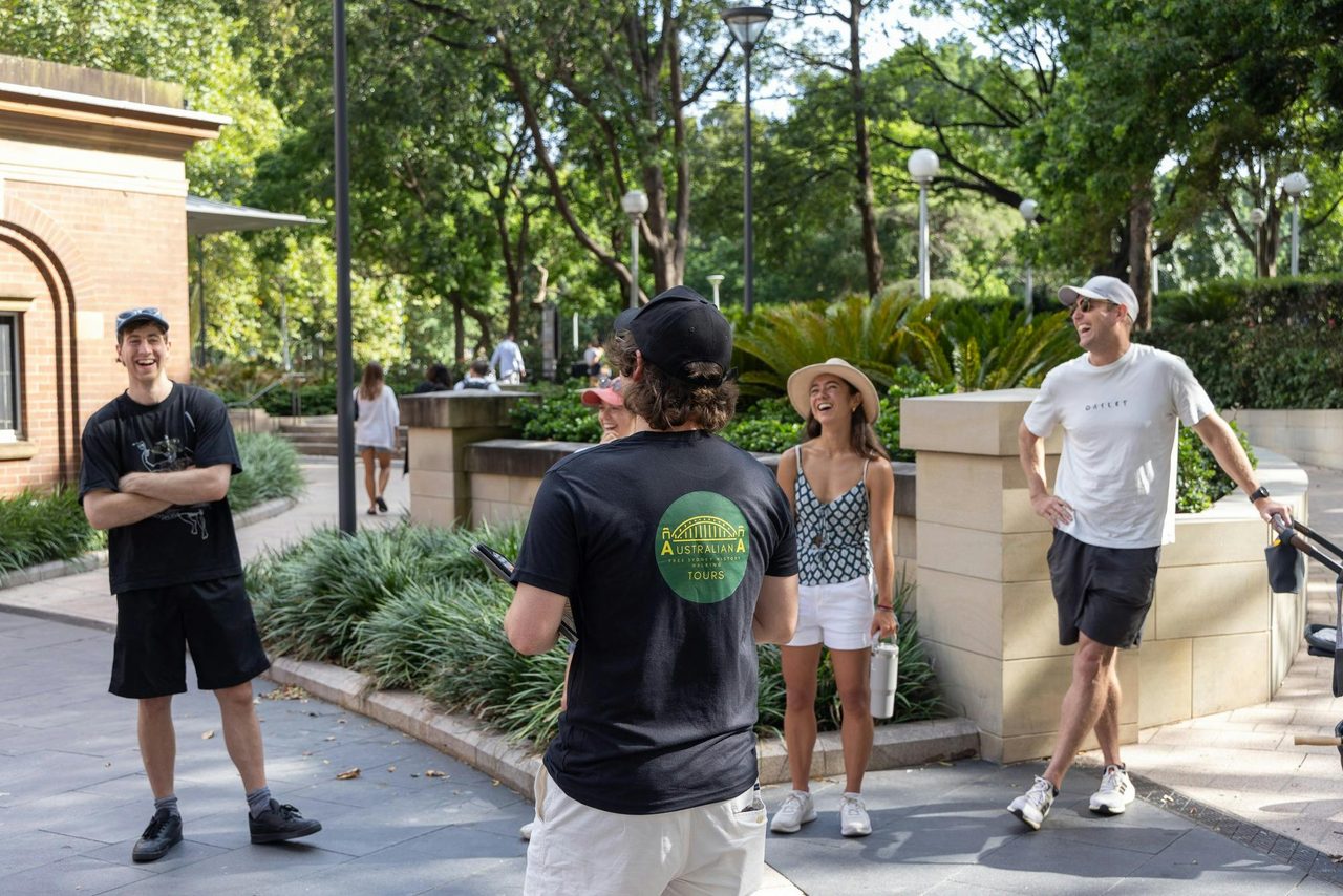 Australiana Tour Guide facing laughing crowd at the Free Sydney History Walking Tour