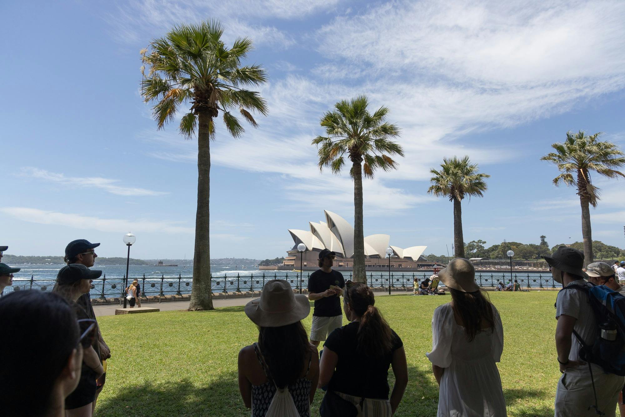 Australiana Tour Guide talking to crowd in front of the Sydney Opera House