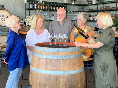 5 people tasting wine