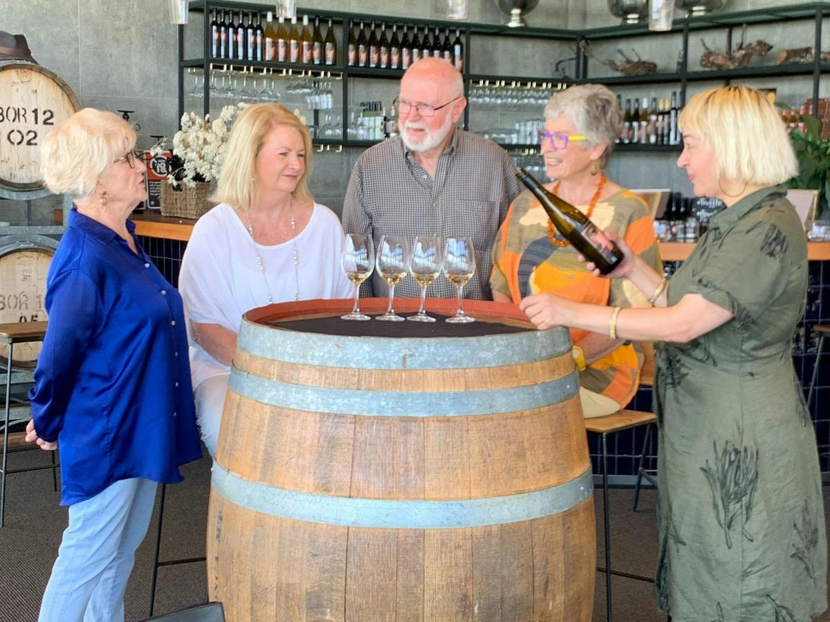 5 people tasting wine