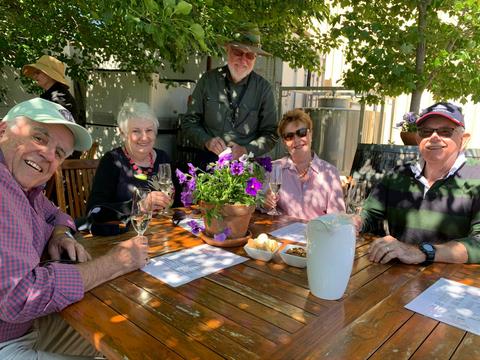 5 people tasting wine