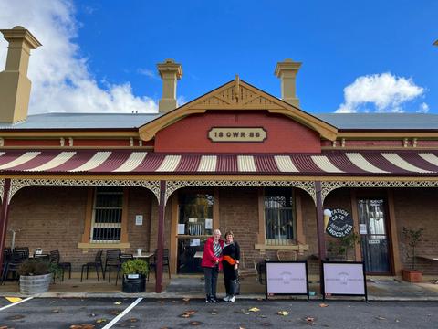2 ladies standing in front of Millthorpe railway station